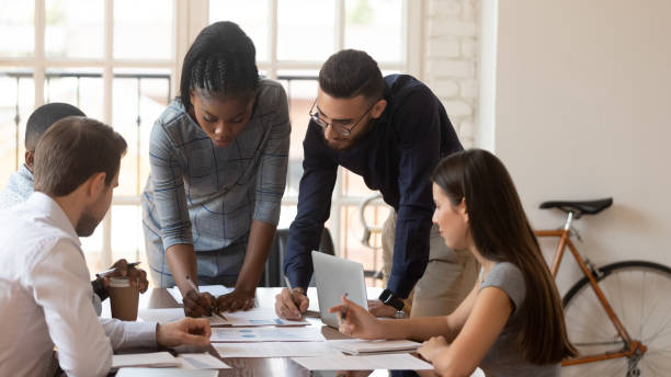 istock Diverse millennial colleagues brainstorm cooperating at meeting 1263380505