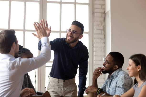 istock Smiling multiethnic male colleagues celebrate shared success 1263380524