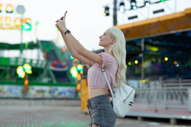 istock Taking selfie in the amusement park 1263383327