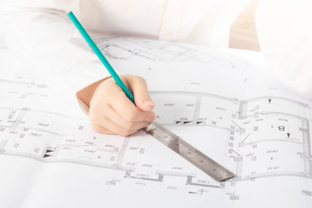 istock A business man on a construction site looks at an architectural project 1263399183