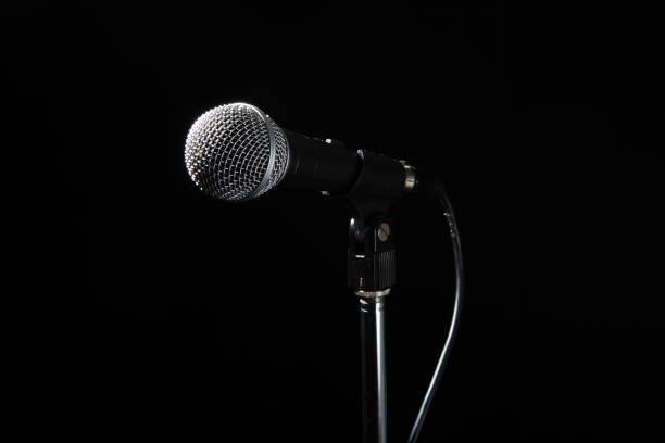 istock Black classic microphone on black dark background. Music and concert concept. 1263401846