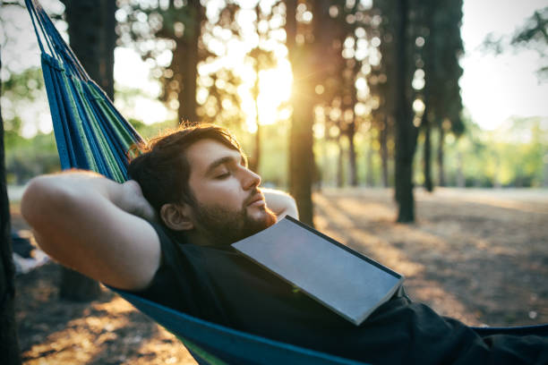 Leisure activity in the forest, man in resting