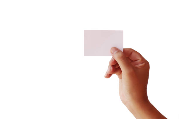 istock Human hands holding blank cards isolated on white background with the clipping path. 1263404324