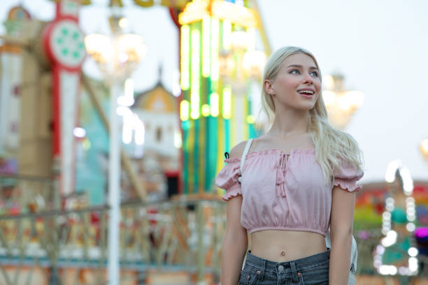 istock Young woman having fun at the amusement park 1263404422