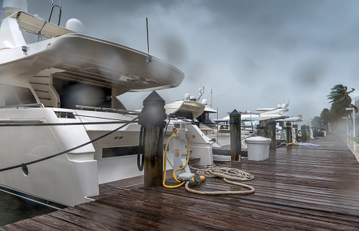 Hurricane season in full activity with torrential rain and strong winds in a Miami Beach marina.