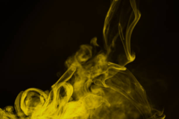 istock Yellow steam on a black background. 1263405223