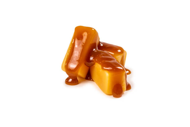 istock Tasty caramel candy isolated on white background. 1263405243