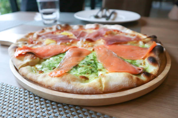 istock salmon pizza , salami pizza or mixed pizza 1263405441