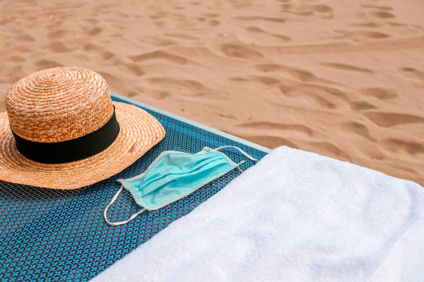 istock Beach Day with Covid-19 Corona Face Mask 1263405669