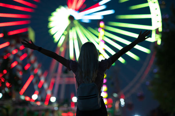 istock Lovely young woman having fun at a amusement park 1263405719