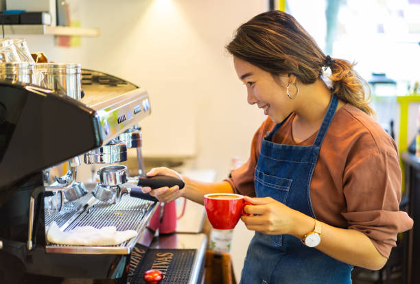 istock Asian female barista making cappuccino 1263405756