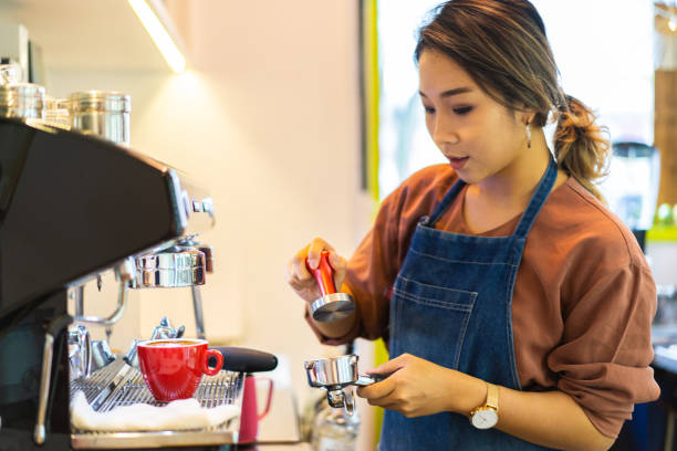 istock Asian female barista making cappuccino 1263405828