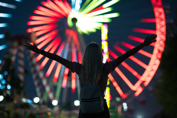 istock Lovely young woman having fun at a amusement park 1263405837