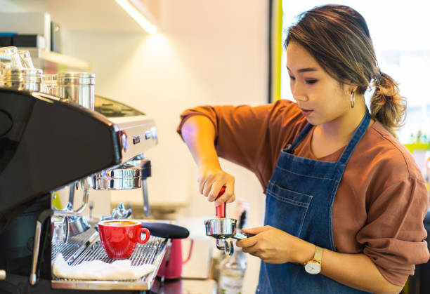 istock Asian female barista making cappuccino 1263405853