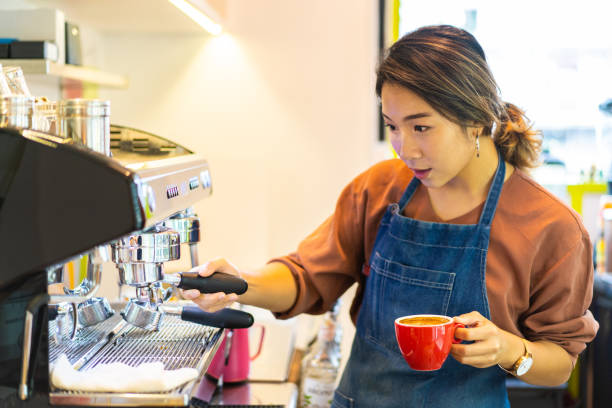istock Asian female barista making cappuccino 1263405899