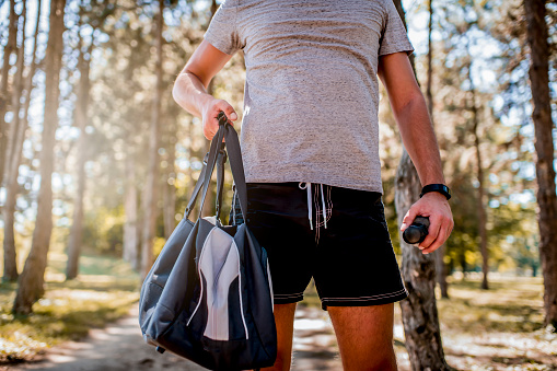 Close up of man holding sports bag
