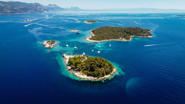 istock Aerial panorama above the Moro Beach Stupe with crystal clear waters below 1263408795