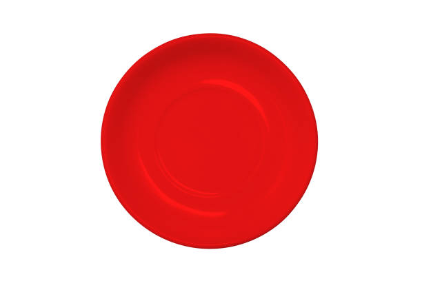 istock An empty red plate isolated on a white background. Colored dishes for food for Breakfast, dinner or lunch. Kitchen items. A top view of a flat layout. 1263412857