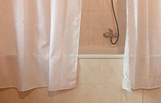 istock Shower curtain in old tiled bathroom, Czech Republic 1263417725