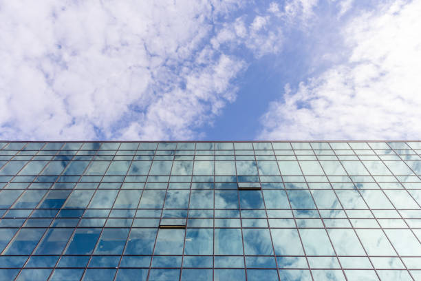 istock Modern office building and sky with clouds 1263418216