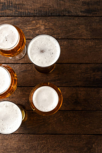 istock Beer glasses on wooden table. 1263419675