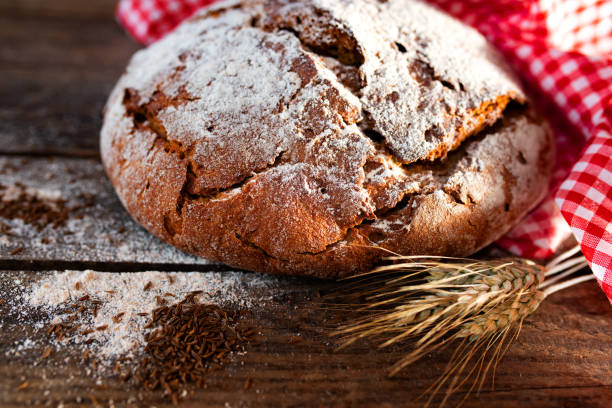 istock Fresh baked bread on rustic wood 1263425778