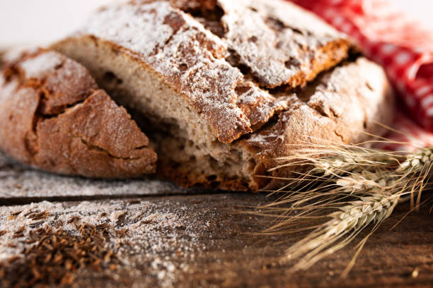 istock Fresh baked bread on rustic wood 1263425781