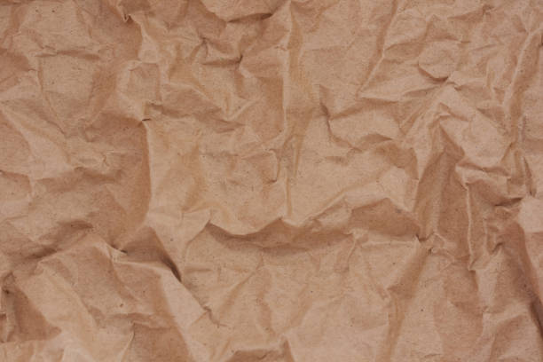 istock brown recycled crumpled paper background: crush  fold texture backgrounds for design, decorative. paper texture concept 1263425930