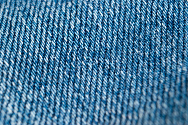 istock Macro shot Blue jeans fabric texture background. Denim jeans texture. Closeup texture and pattern of jeans fabric 1263427467