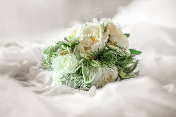 Fresh bunch of white peonies and roses
