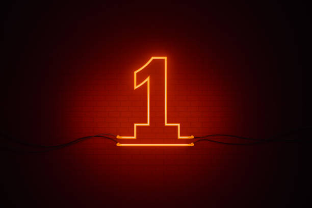 istock Number One Written by Red Neon Light on Black Wall 1263429296