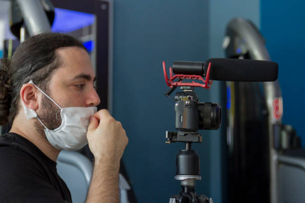 istock Videographer With Surgical Mask In Corona Virus Days 1263433532