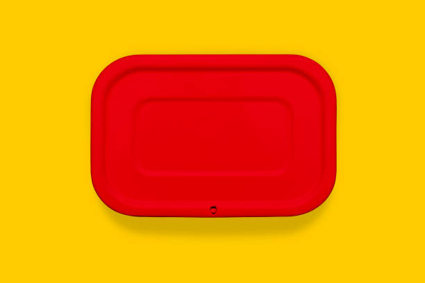 istock Red food container on an orange background. Color-coded packaging for storing Breakfast, dinner or lunch. School food. Food delivery. 1263438004