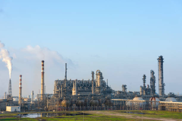 istock The petrochemical refinery is under blue sky and white clouds. 1263440159
