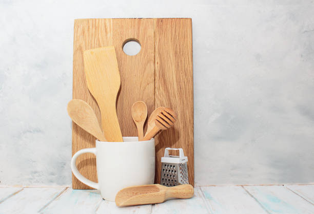 istock Kitchen wooden spoons for sugar, spices, honey, plate in white cup 1263441207