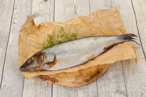 istock Salted herring over the wooden board 1263442600