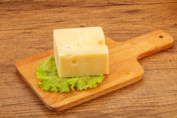 istock Emmental cheese over wooden board 1263442872