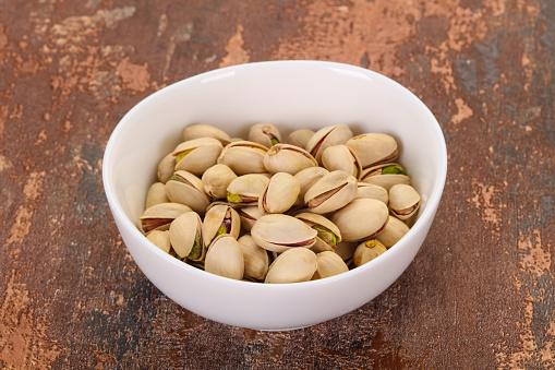 Pistachio nuts heap in the bowl