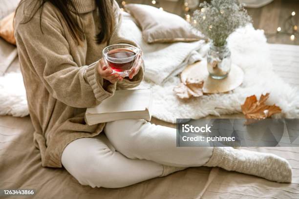 Cozy Autumn Or Winter At Home A Woman In A Knitted Sweater Stock Photo - Download Image Now