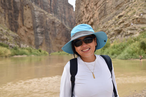 istock Attractive model at Rio Grande border - Mexico and Texas 1263446201