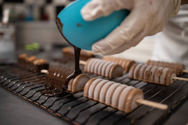 istock Chef pouring hot chocolate on chocolate biscuit 1263447329