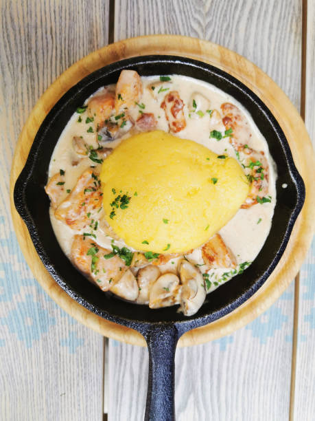 Mamaliga is a Romanian and Moldavian national dish Mamaliga is a Romanian and Moldavian national dish with meat and mushrooms mamaliga stock pictures, royalty-free photos & images