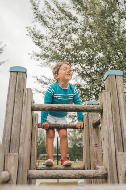 istock Little boy climbing on the playground 1263451367