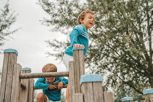 Little boys climbing on the playground