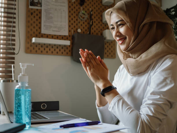 istock Islam woman using antibacterial hand sanitizer 1263451521