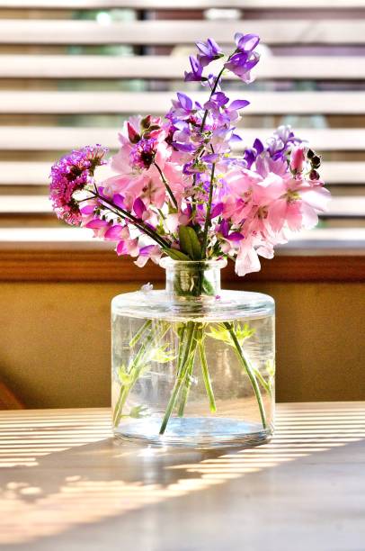 istock Cut flowers in glass 1263451603
