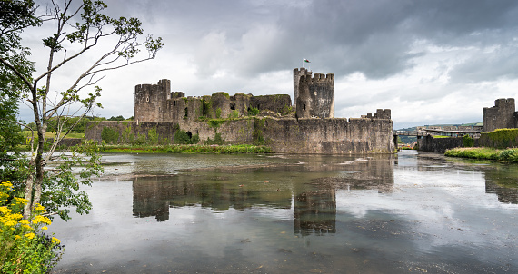 Caerphilly Castle Reflecting in the Moat, in Monmouthshire