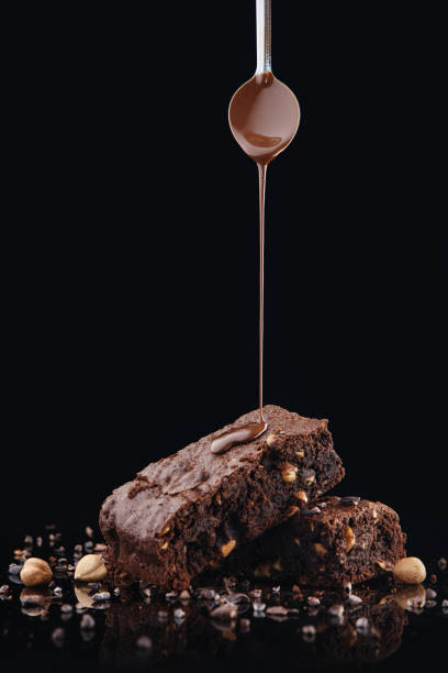 istock Brownie pieces on black background. Delicious chocolate pie. 1263455150