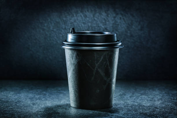istock black coffee paper cup on dark background 1263455394