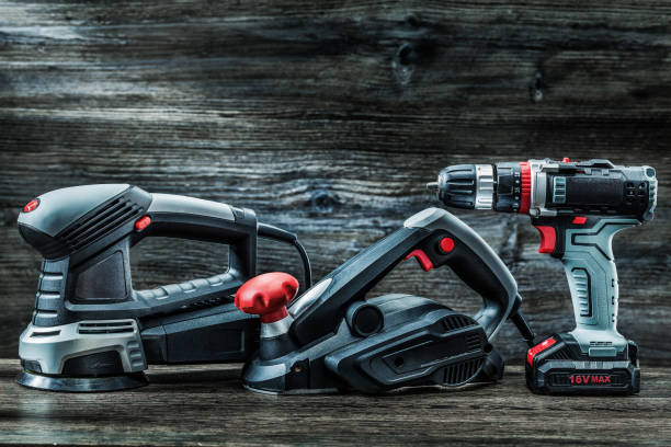 istock electric hand tools orbit wood sander planer and cordless drill driver on vintage wood 1263455442